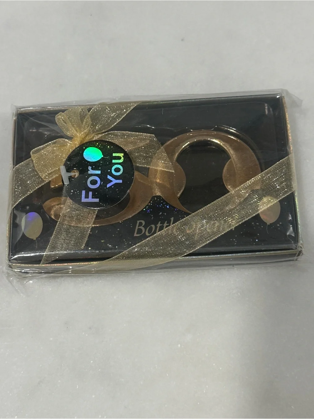 50th Celebration Gold Bottle Opener giveaway to guests